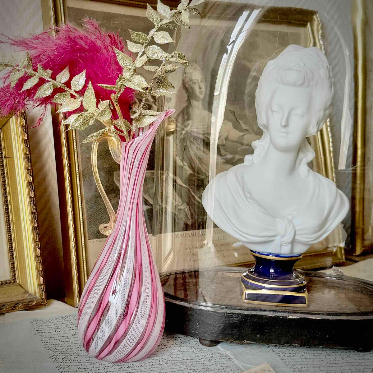 Vintage Murano glass ewer vase featuring pink and white latticino filigree patterns, mid-20th century Italy.