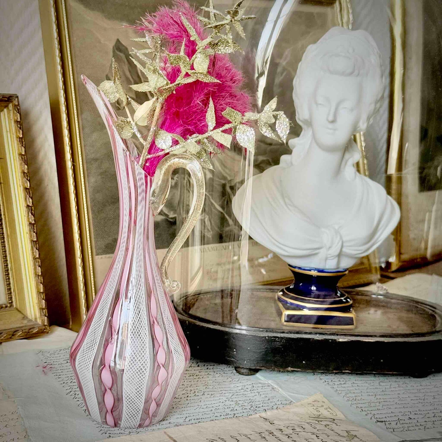 Vintage Murano glass ewer vase featuring pink and white latticino filigree patterns, mid-20th century Italy.