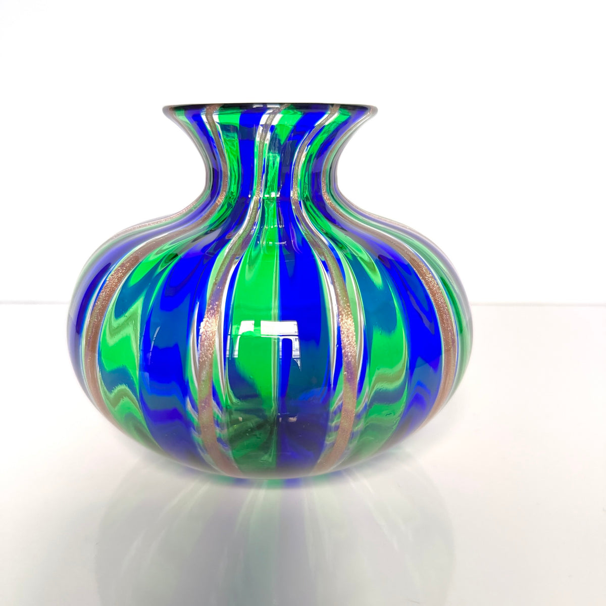 Vintage Murano blown glass vase attributed to Livio Campanella, featuring emerald green, blue, and fine gold flakes.