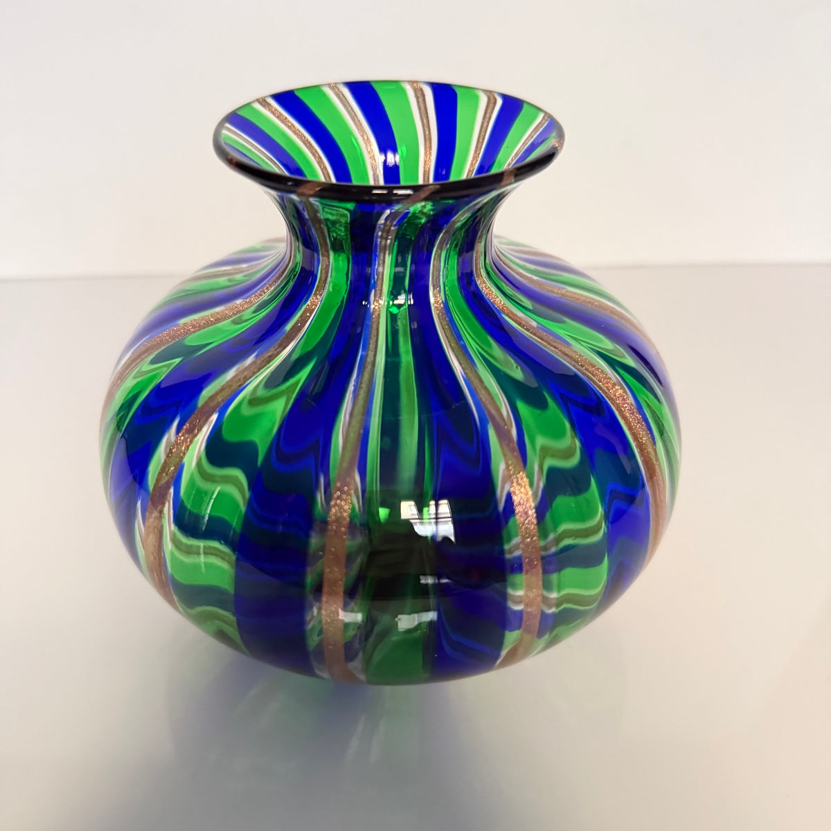 Vintage Murano blown glass vase attributed to Livio Campanella, featuring emerald green, blue, and fine gold flakes.