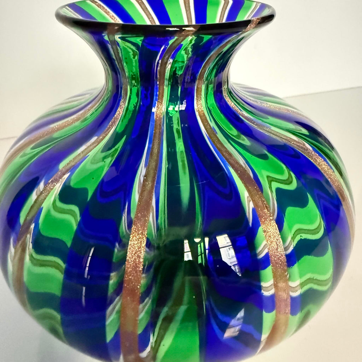 Vintage Murano blown glass vase attributed to Livio Campanella, featuring emerald green, blue, and fine gold flakes.